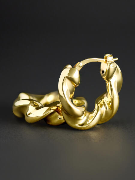 Hoop earrings with a flowing texture that resembles fabric in the wind.