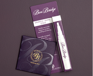 Contents of a Ben Bridge jewelry care kit, including instructions, polishing cloth and cleaning solution