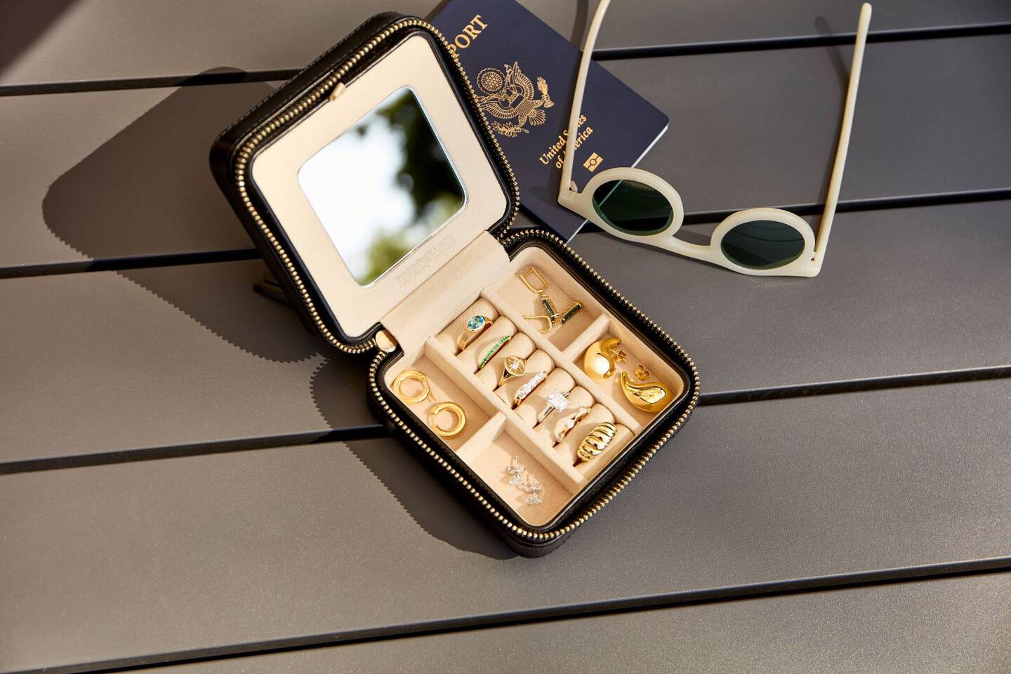 gold and diamond jewelry neatly arranged in a travel jewelry case