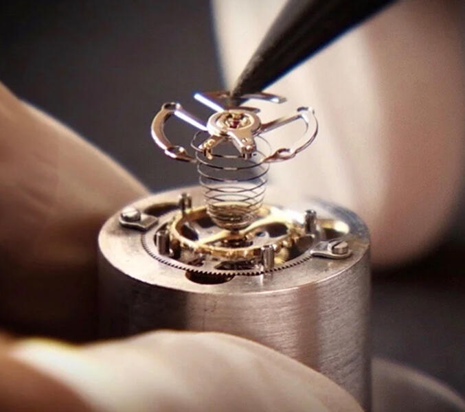 Close‑up of a Franck Muller mechanical component showcasing intricate engineering, fine finishing, and advanced Swiss watchmaking techniques.