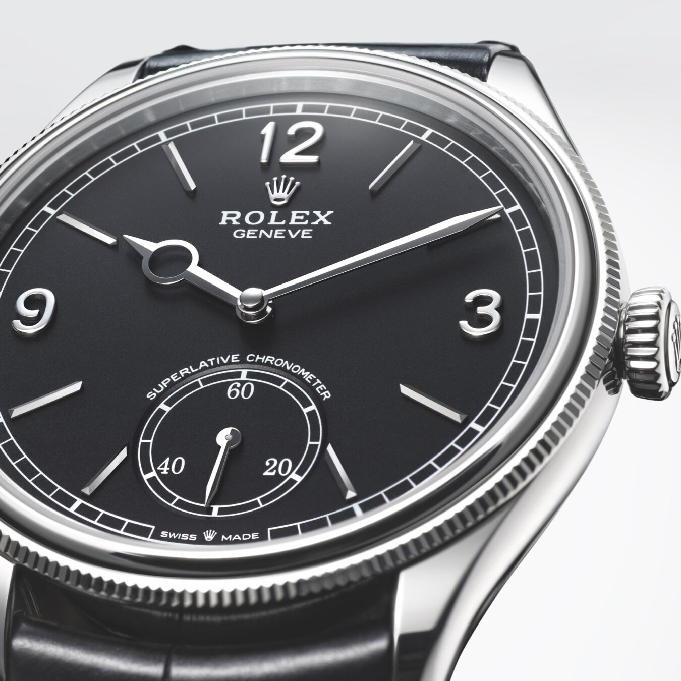 Close up of intense black dial and white gold indices of the Rolex 1908. 
