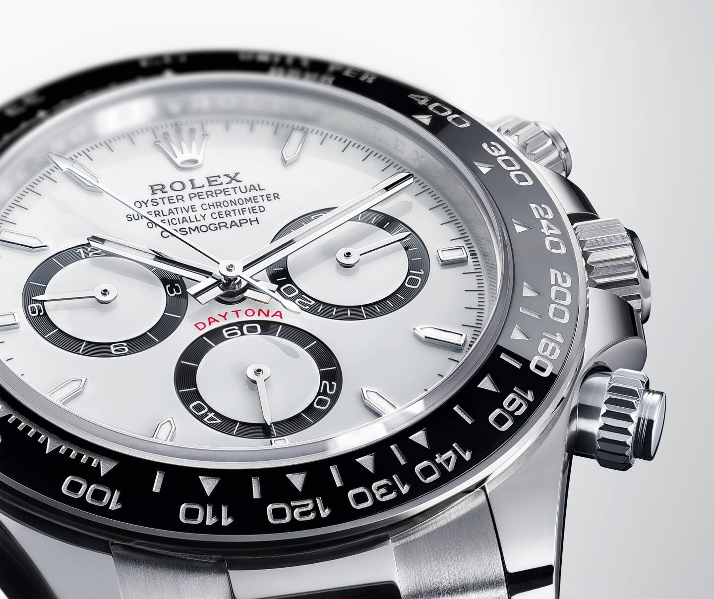 closeup of the iconic Rolex Cosmograph Daytona face with white dial and black bezel
