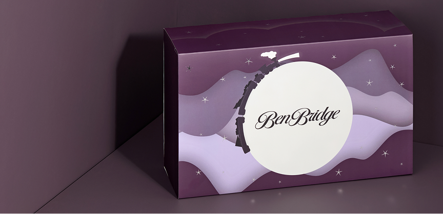 The Ben Bridge advent calendar, unopened, depicts a night sky with a full moon and twinkling stars.