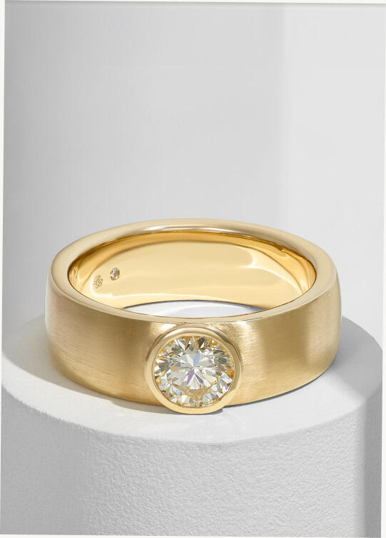 Bold diamond wedding band in 14k yellow gold.