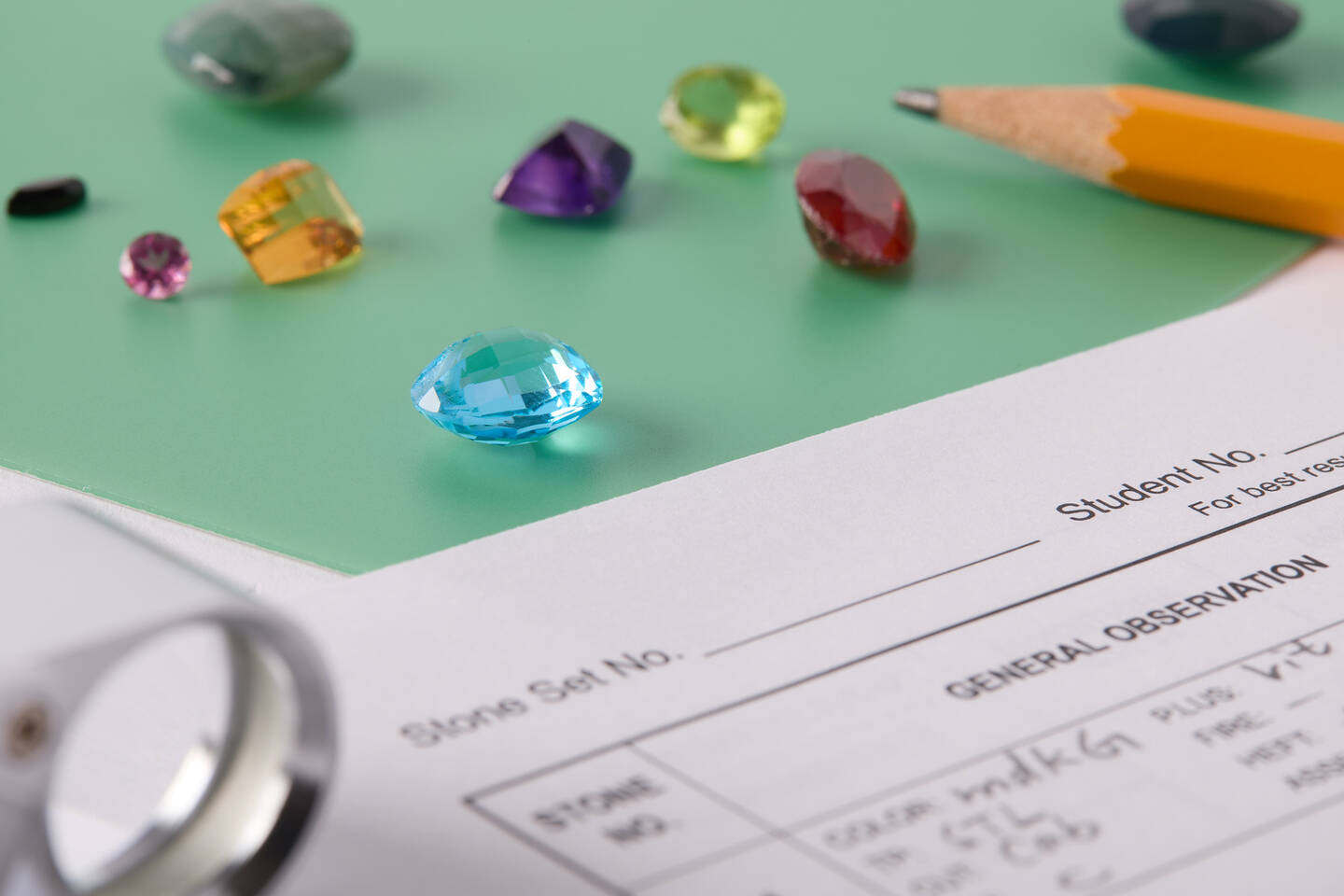 Gemstones scattered on a worksheet