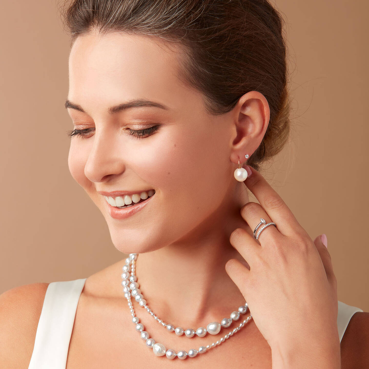 woman adorned with pearl jewelry