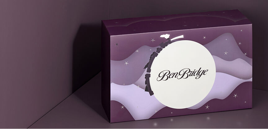 The Ben Bridge advent calendar, unopened, depicts a night sky with a full moon and twinkling stars.