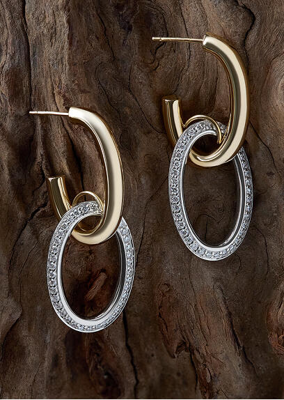 Gold hoop earrings with hanging ovals of pave diamonds set in white gold.