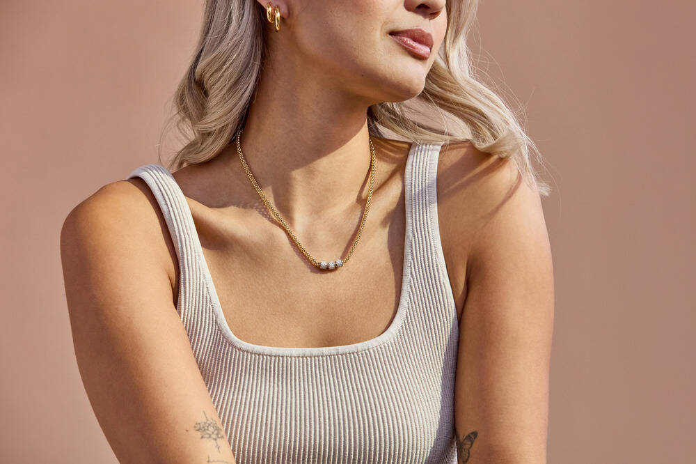 several varieties of gold chains glimmer in the light. 