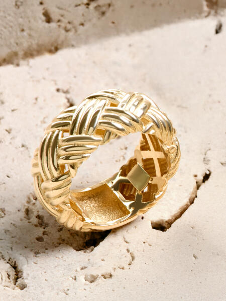 A bold yellow gold ring with a basket weave texture.