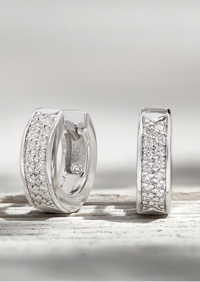 White gold hoop earrings with pave diamonds.