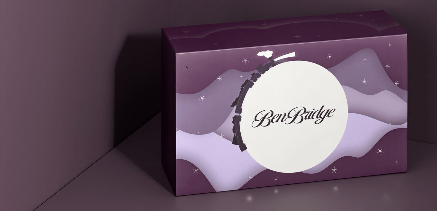 The Ben Bridge advent calendar, unopened, depicts a night sky with a full moon and twinkling stars.