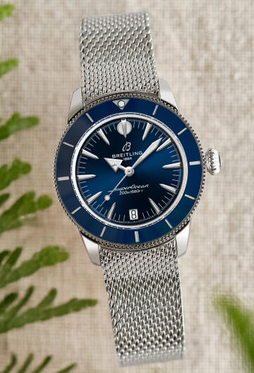 A vintage-inspired dive watch with a blue dial and stainless steel case and bracelet.