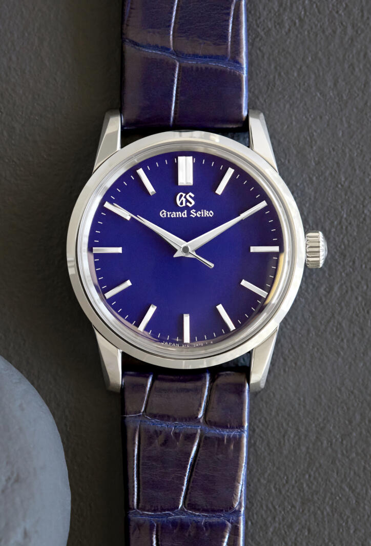 Grand Seiko watch with a blue dial and blue leather strap.