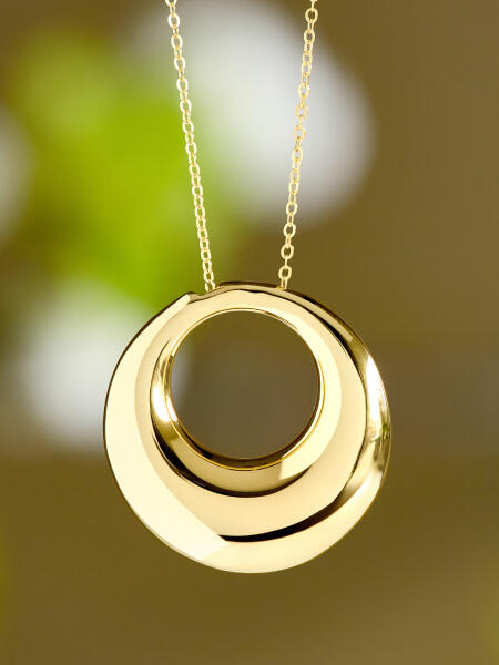 Yellow gold pendant necklace, round with an open center.