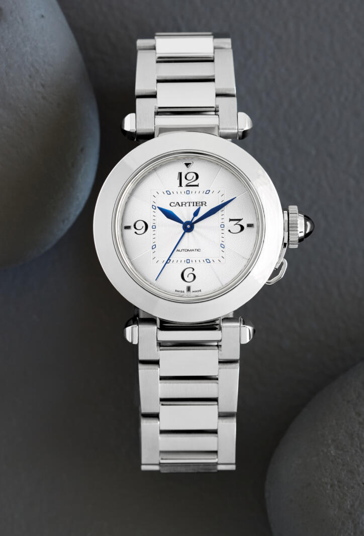 Stainless steel watch with blue hands and a white dial.