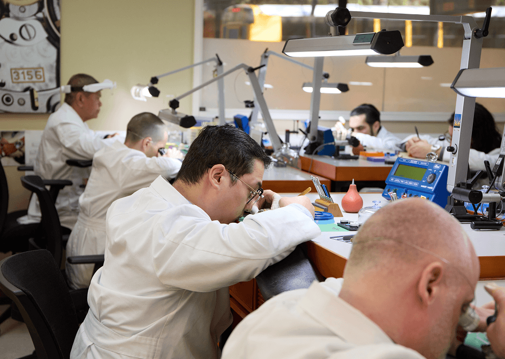 Watch technicians inspecting watches
