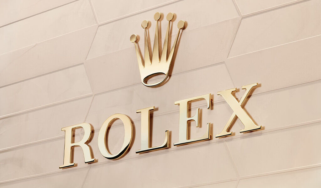 Beautiful gold Rolex sign shimmers in the afternoon light. 