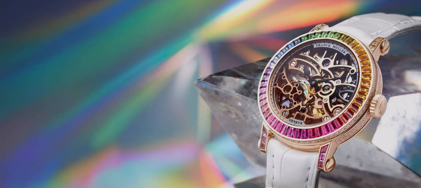 Franck Muller Gen&egrave;ve skeletonized timepiece featuring a multi‑color gemstone bezel, intricate mechanical movement, and refined Swiss craftsmanship.
