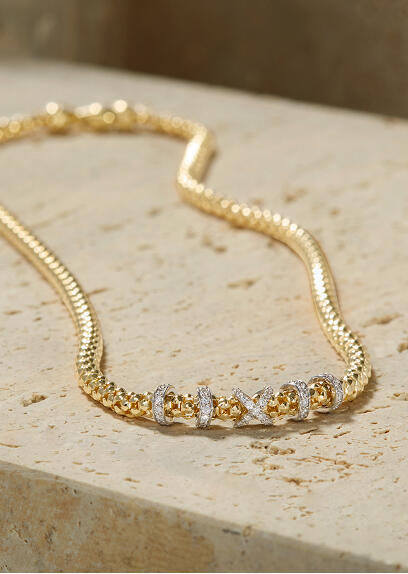 An Italian crafted yellow gold necklace with diamond stations set in white gold.