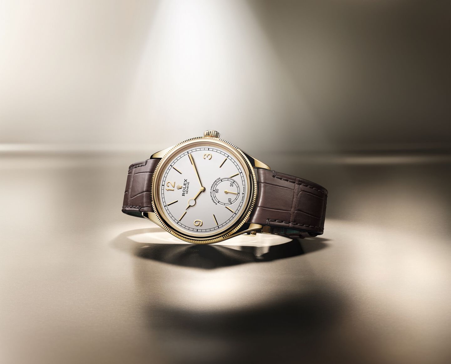 Rolex 1908 in 18k yellow gold with brown leather strap leaning on its side