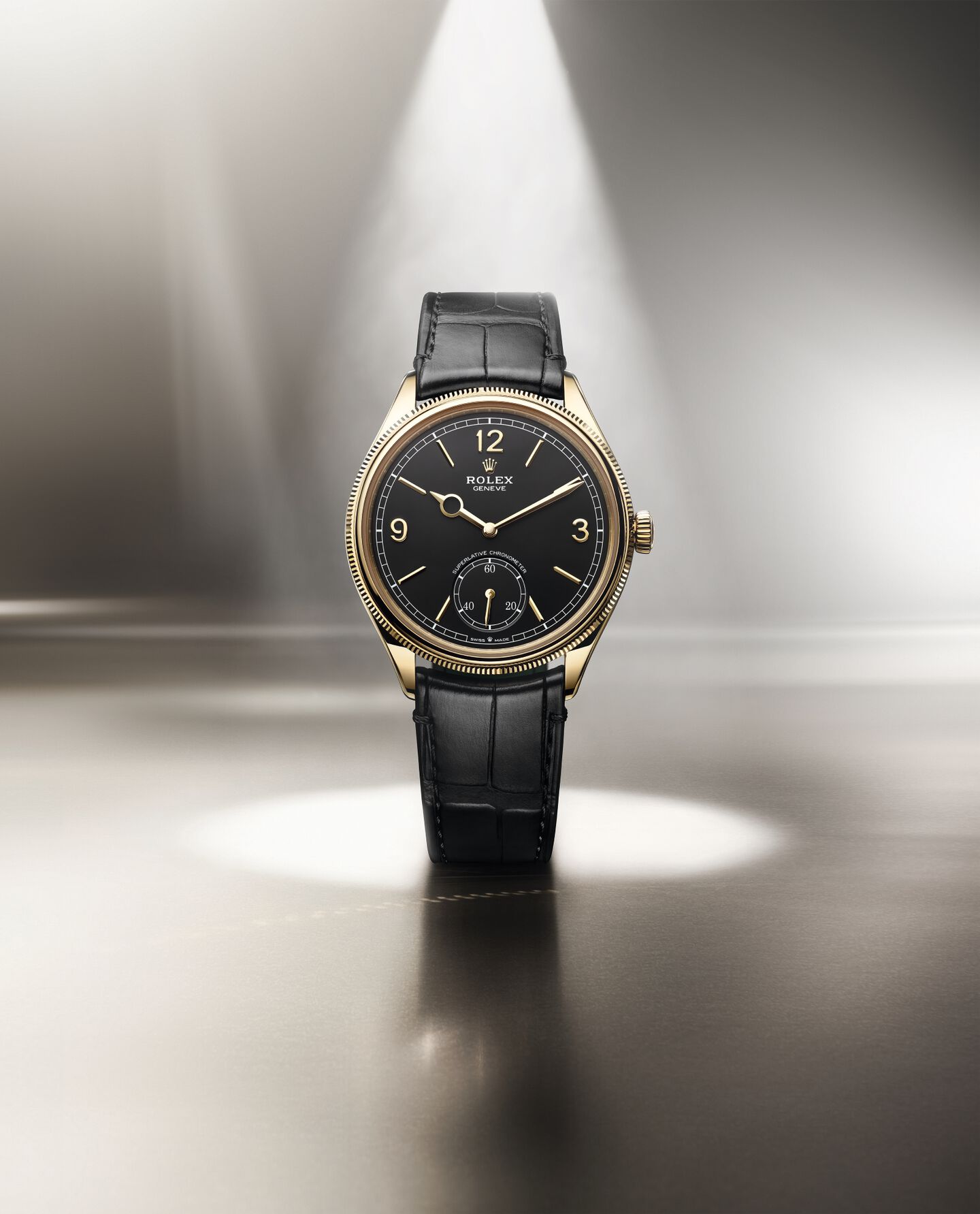 Rolex Oyster Perpetual 1908 in 18k gold with black dial and leather strap