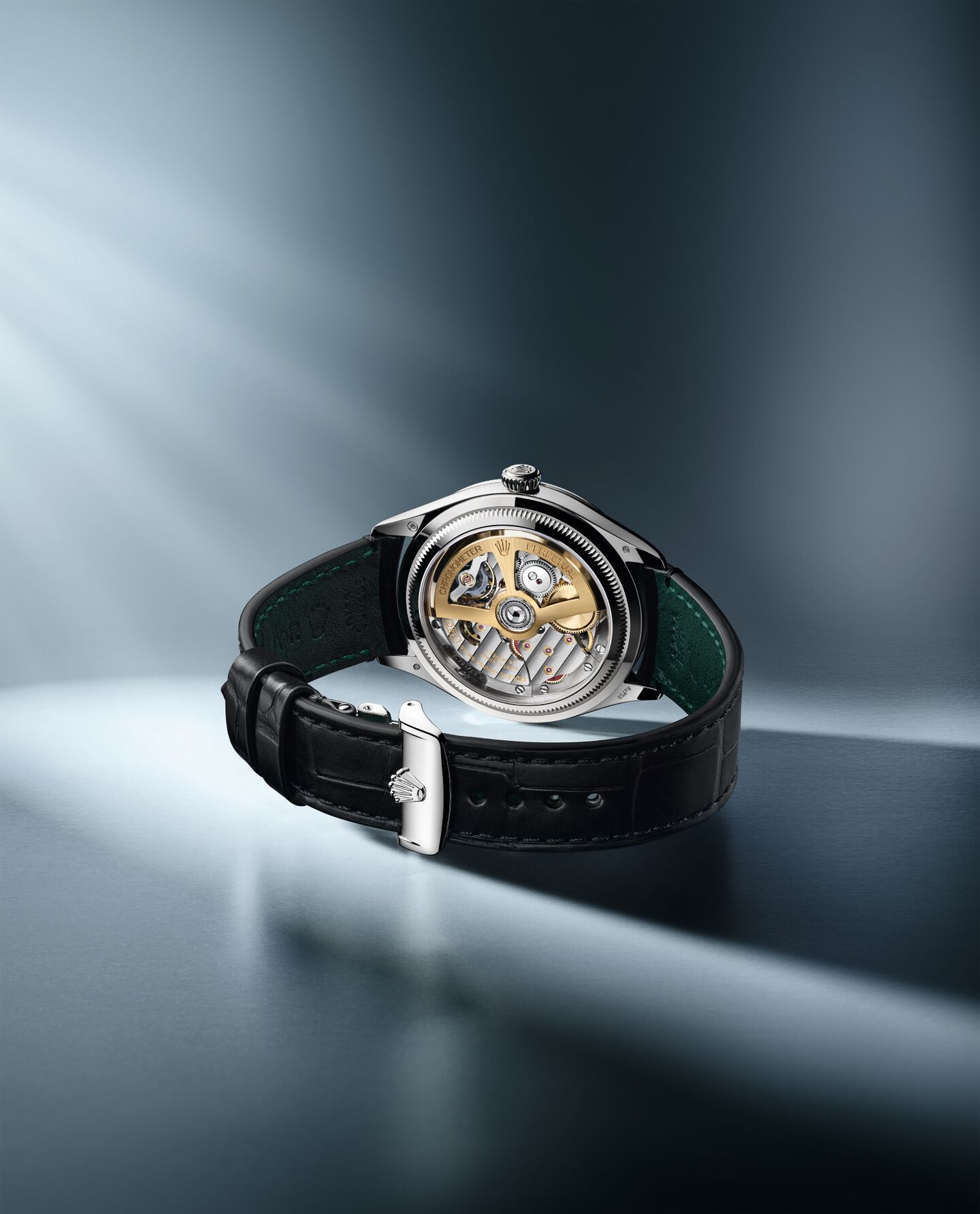 A Rolex Oyster Perpetual 1908 from the back, showing the automatic movement inside