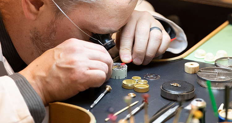 Watchmaker working on a watch