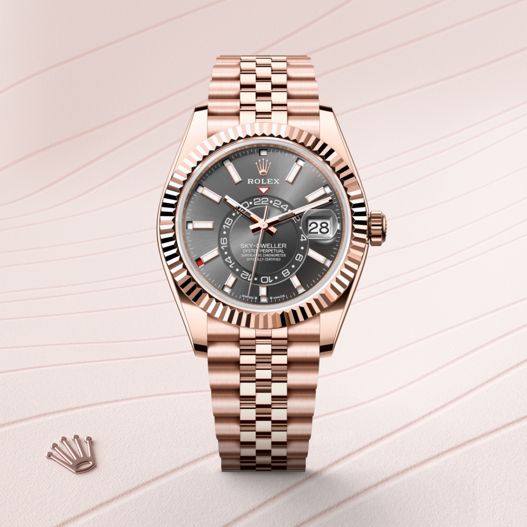 rolex sky-dweller in 18 ct everose gold, m336935-0008 - watch with background color - ben bridge